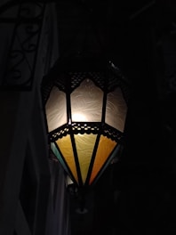 Hand-forged metal lanterns glowing softly, showcasing intricate Moroccan patterns.