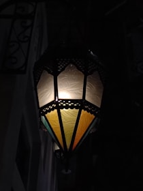 Hand-forged metal lanterns glowing softly, showcasing intricate Moroccan patterns.