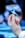 A hand delicately holding a blue awareness ribbon with the background softly blurred to focus on the ribbon.