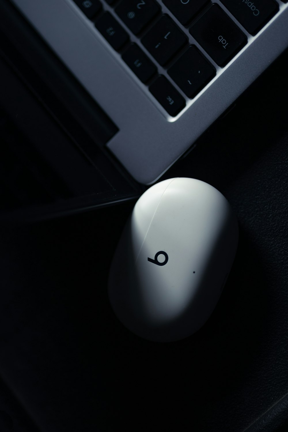 a computer mouse next to a keyboard