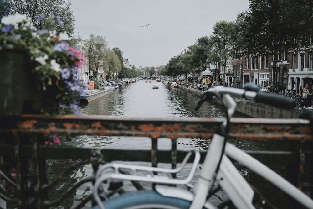 a river with a bridge and boats