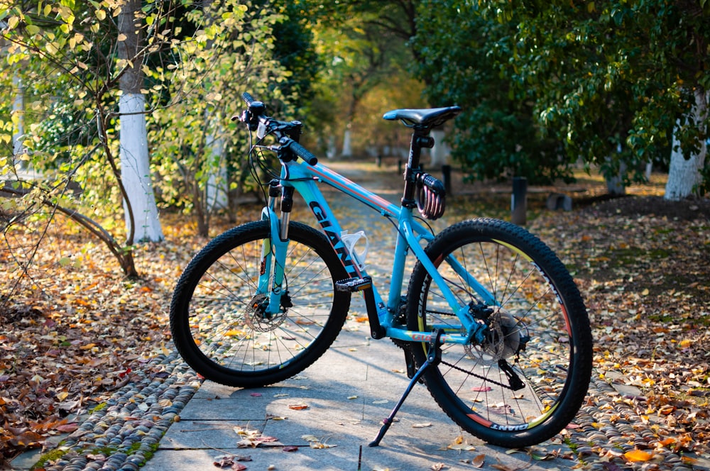 a bicycle parked on a sidewalk