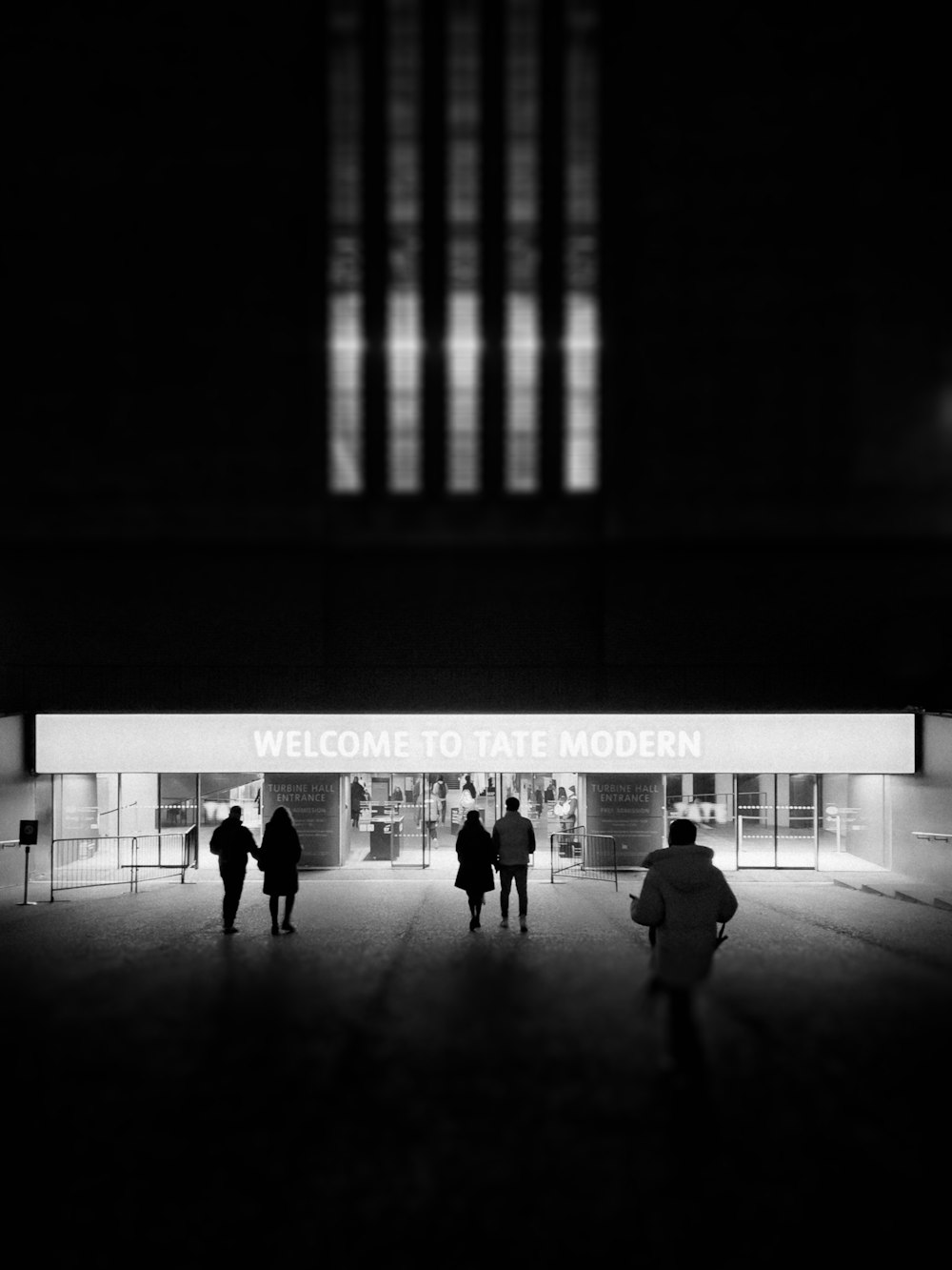 people walking in front of a building