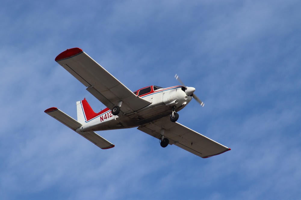 a small airplane flying in the sky