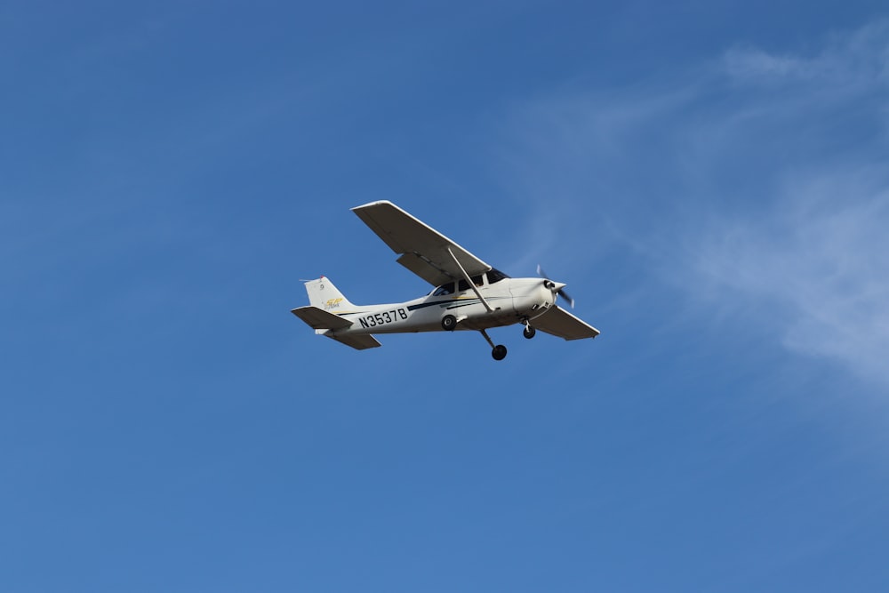 a small airplane flying in the sky
