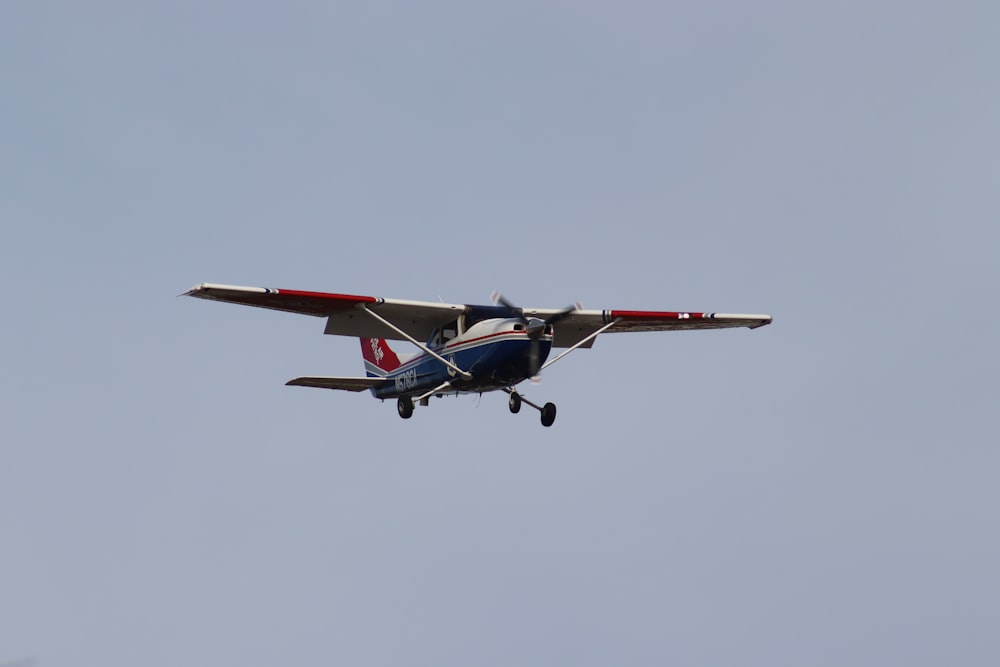 a small airplane flying in the sky