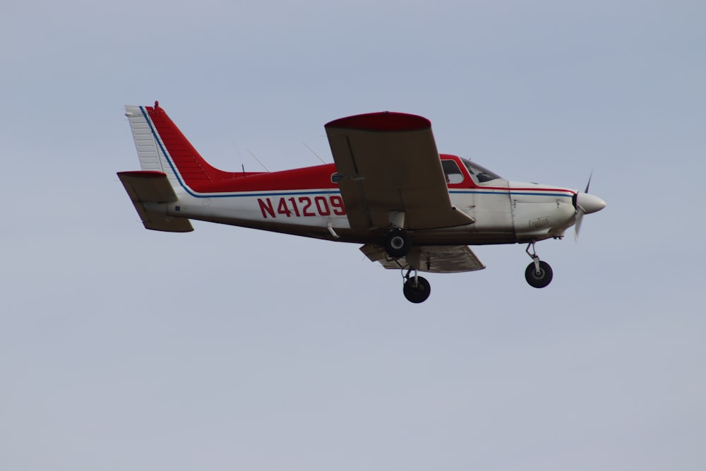 a small airplane flying in the sky