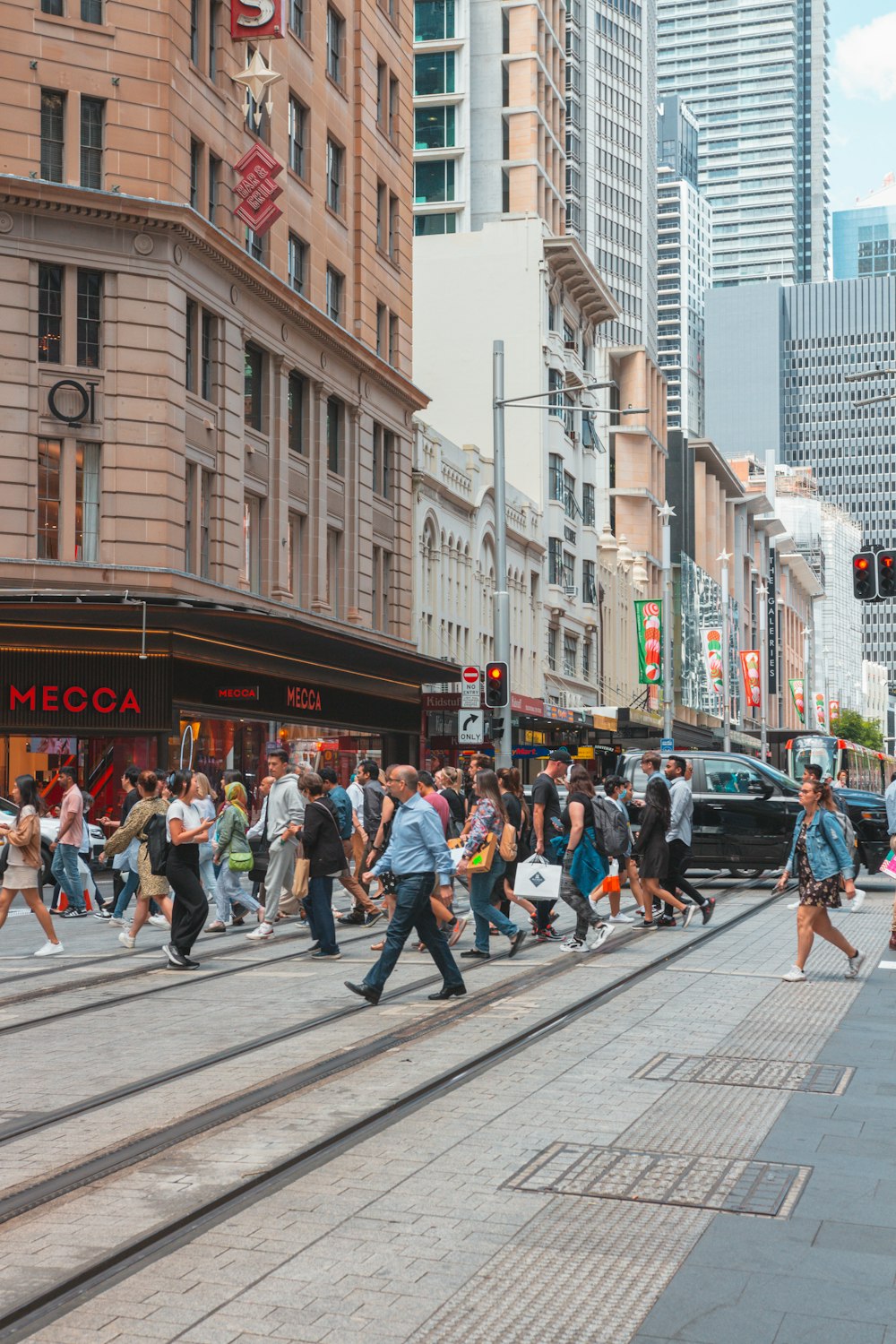 a crowd of people walking on a street