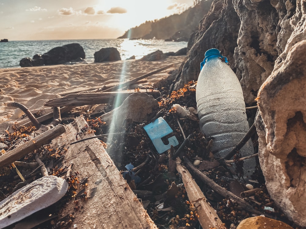 a bottle of water on a beach