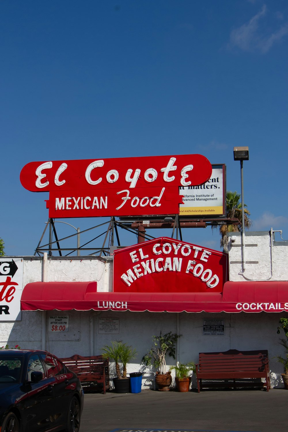 a restaurant with a red sign