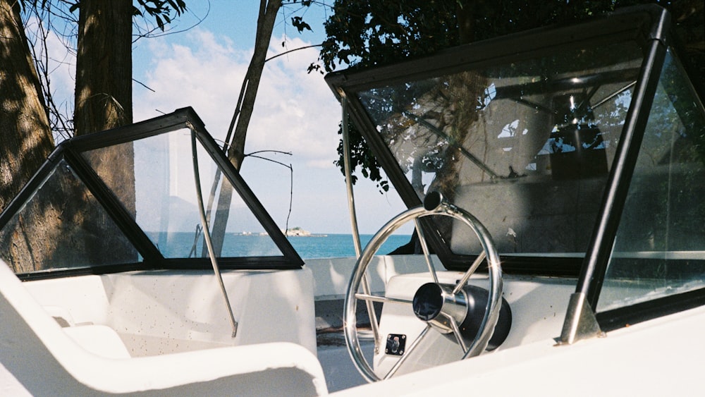 a white car with a steering wheel