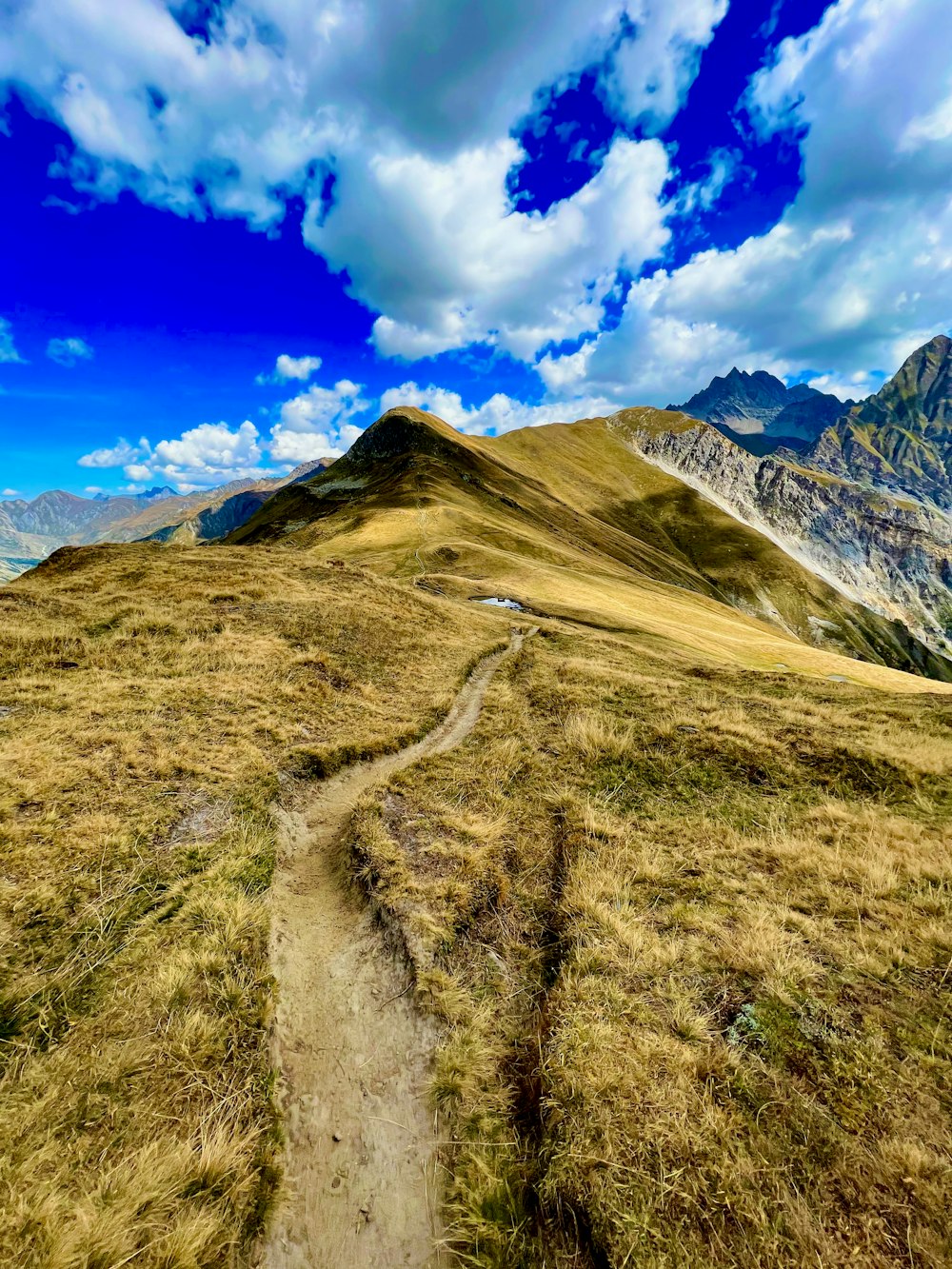 a dirt road in a valley