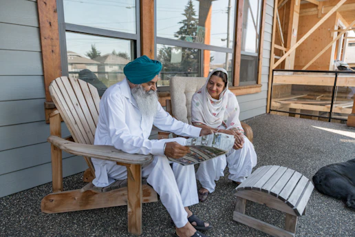 a man and woman sitting on a bench