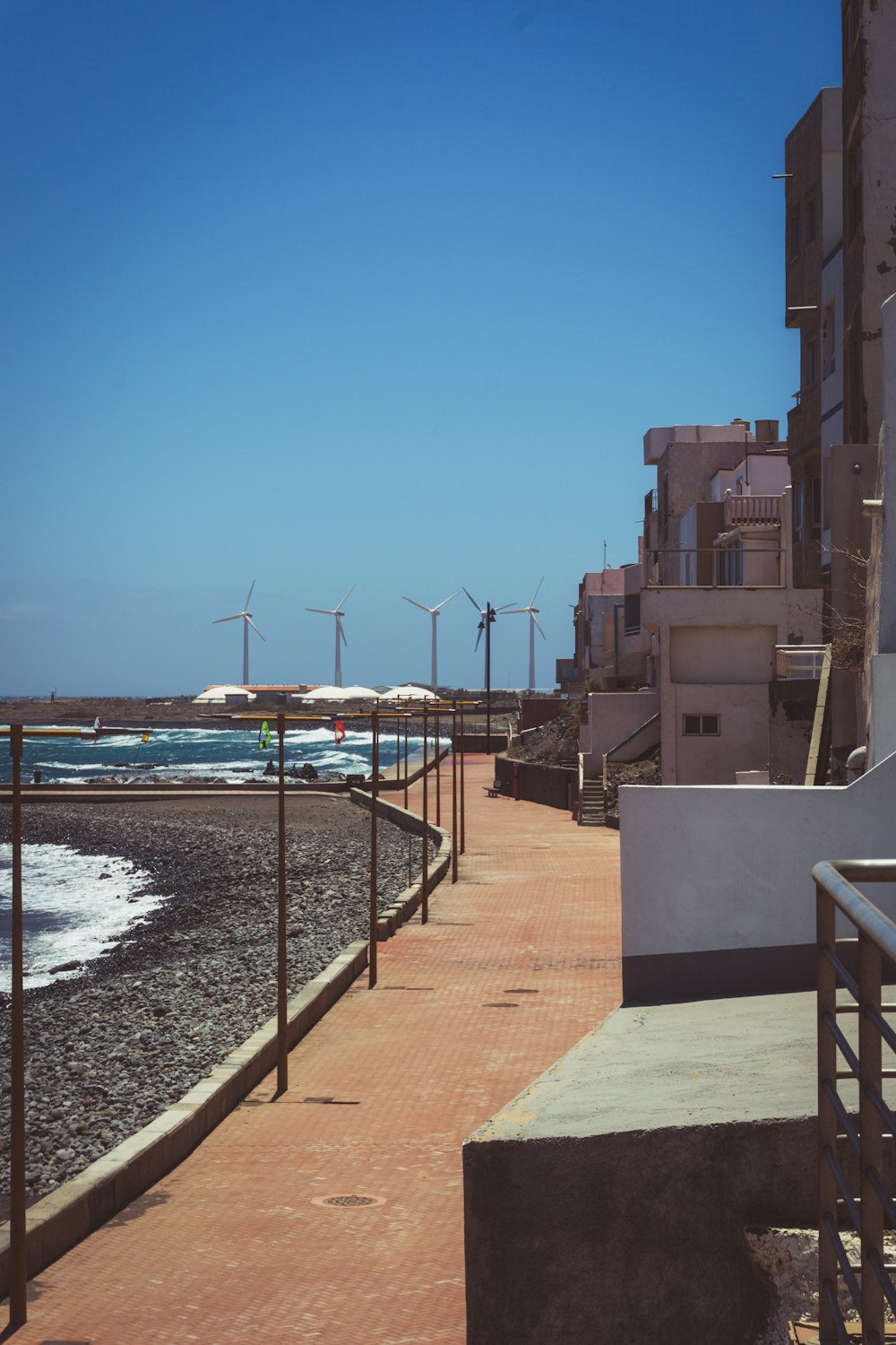 a walkway next to a beach