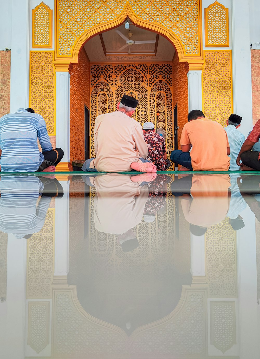 a group of people sitting in a temple