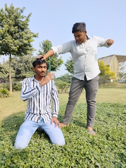 Young men and mentors working together on a community service project outdoors