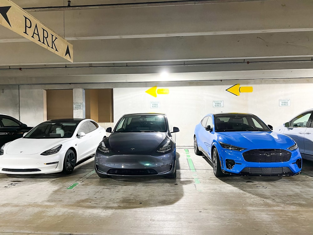 a group of cars parked in a parking garage