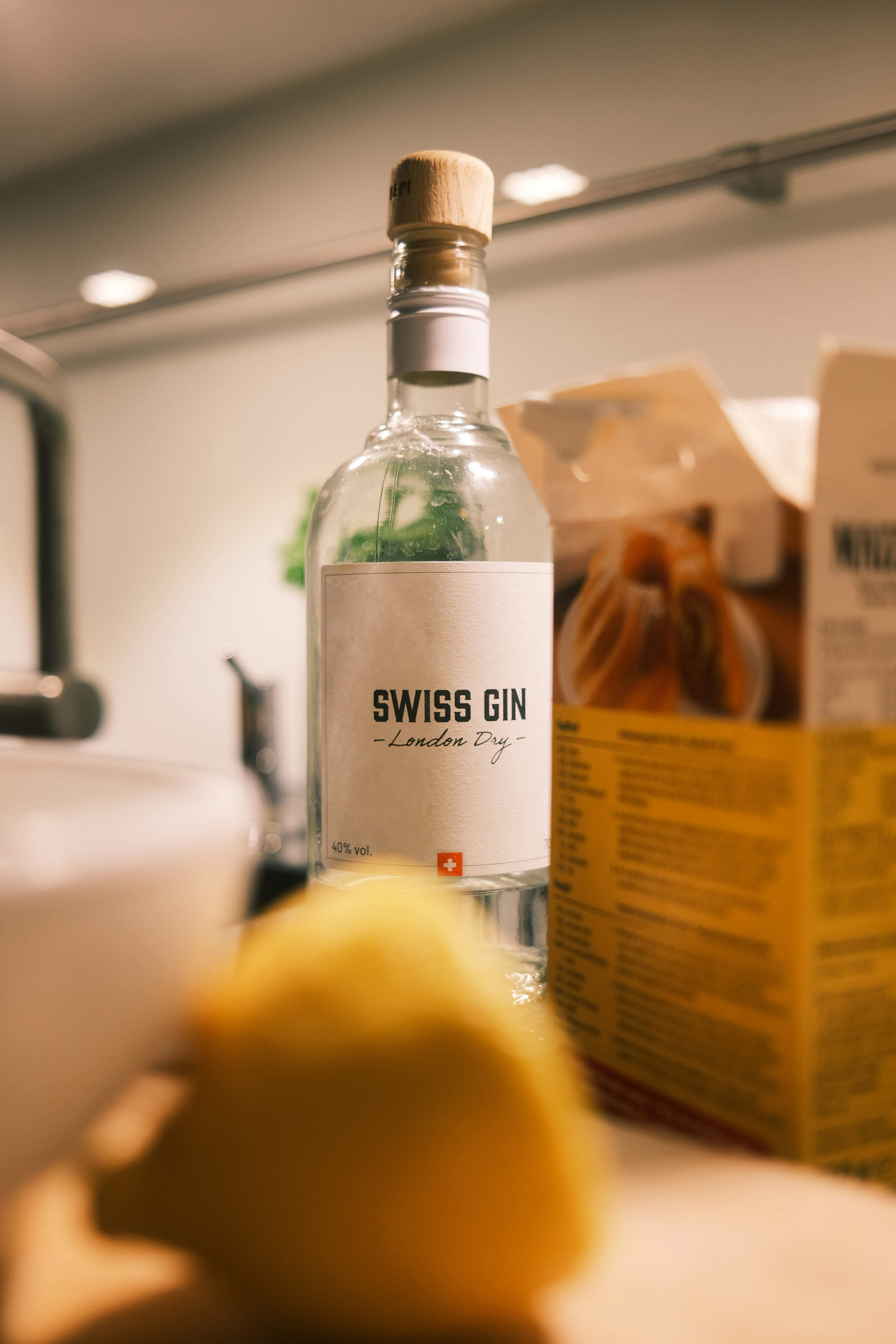 a bottle of alcohol photo Free Switzerland Image on Unsplash