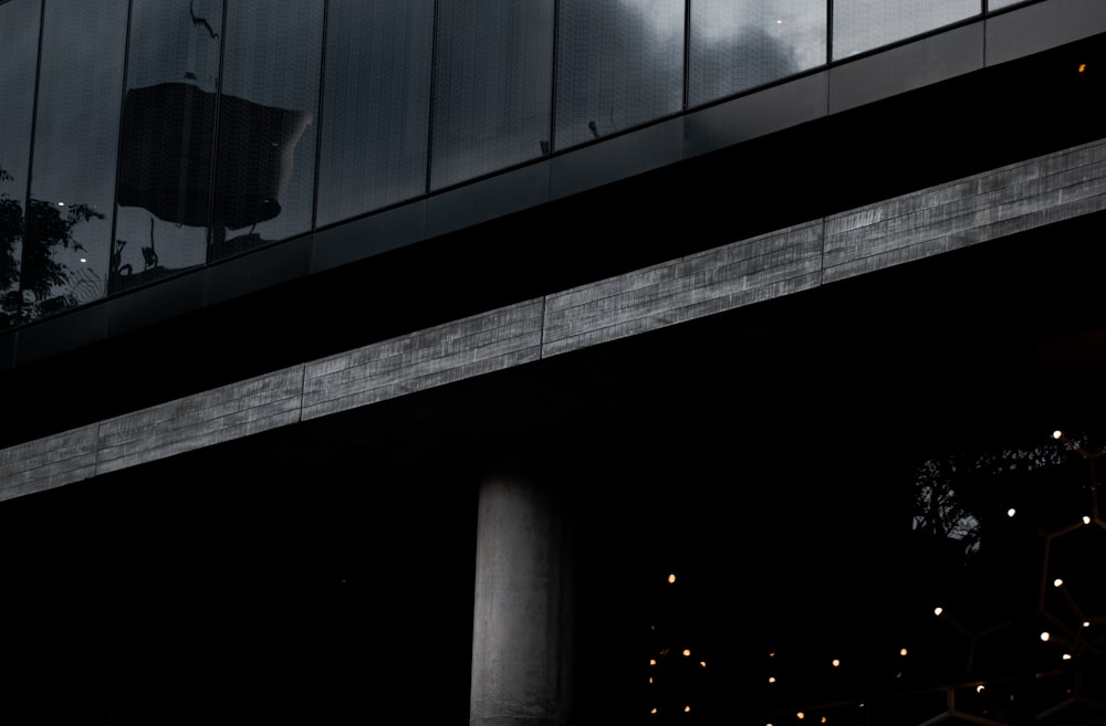 a bridge with a building in the background