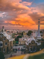Sunset view over the rooftops of Barcelona with the sea in the background.