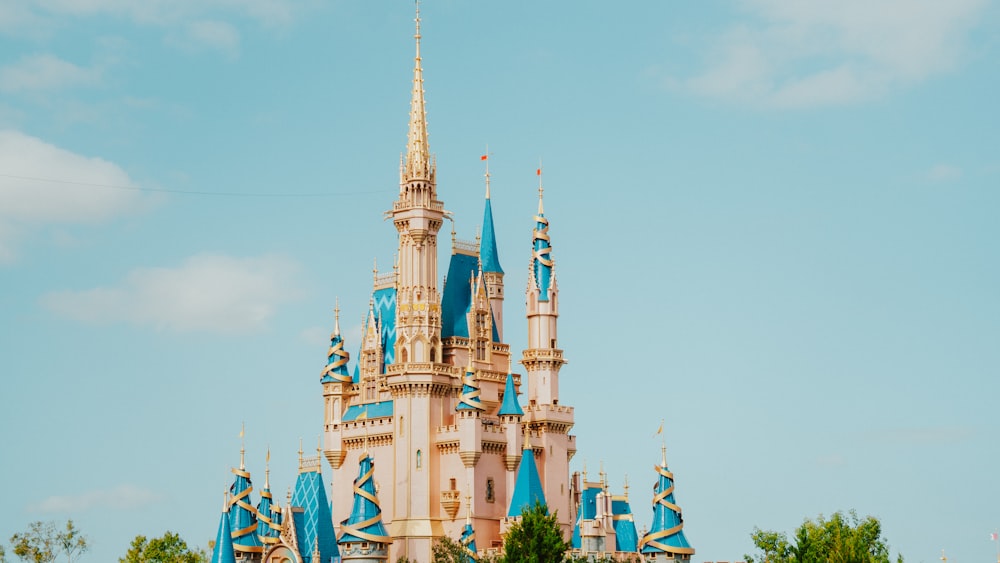 a castle with blue and white spires