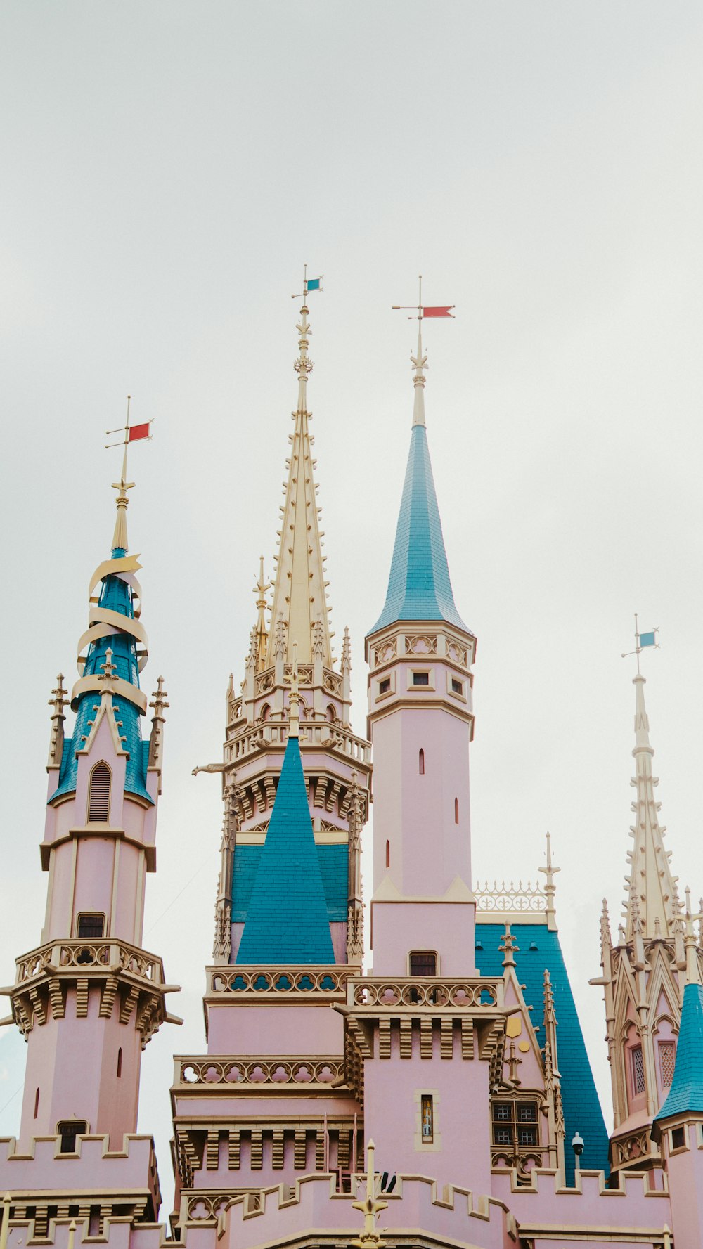 a large castle with blue rooftops