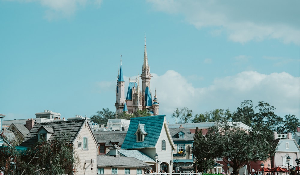 a group of buildings with a church in the background