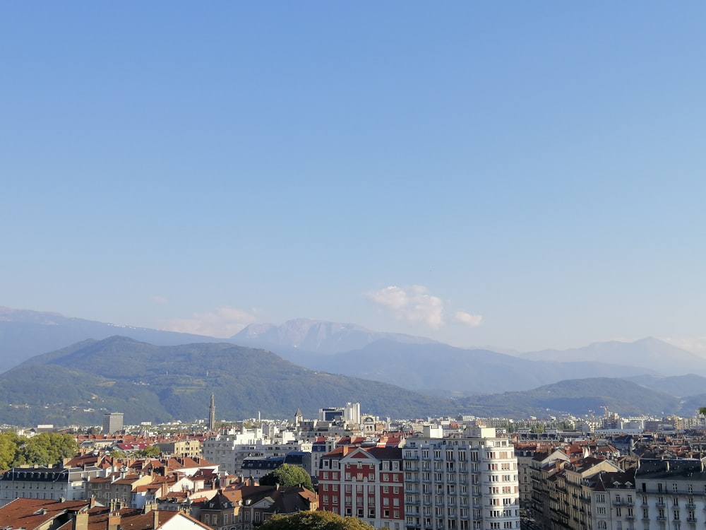 a city with mountains in the background