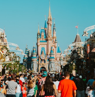 a crowd of people in front of a castle