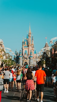 a crowd of people in front of a castle