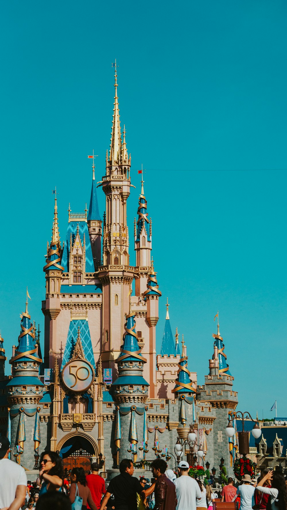 a castle with many people in front of it