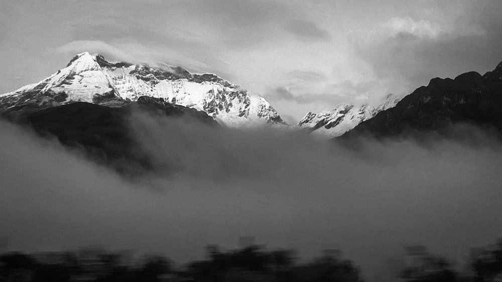 a mountain with clouds around it