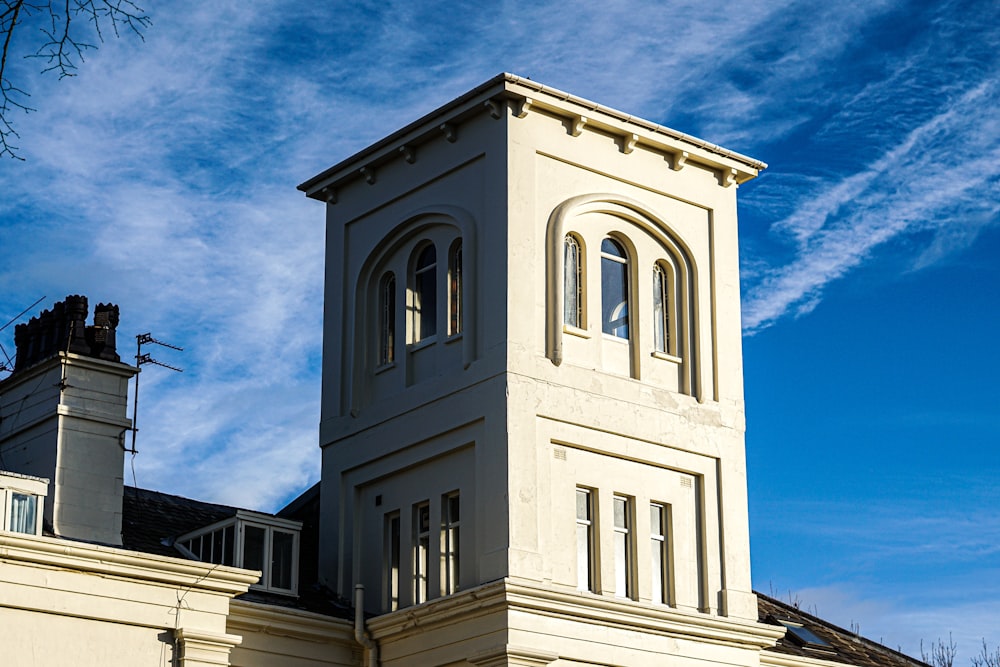 a white building with a tower