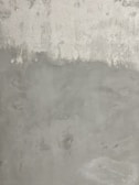 Close-up of textured concrete wall with subtle color variations