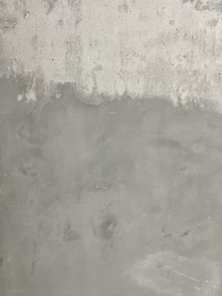 Close-up of textured concrete wall with subtle color variations