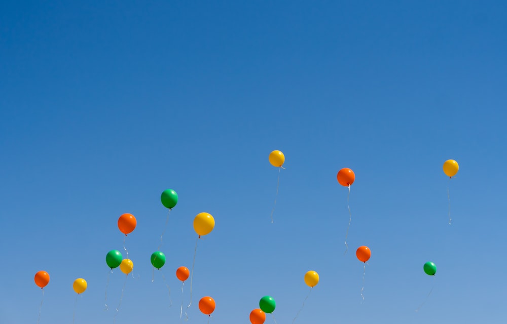 a group of balloons in the sky