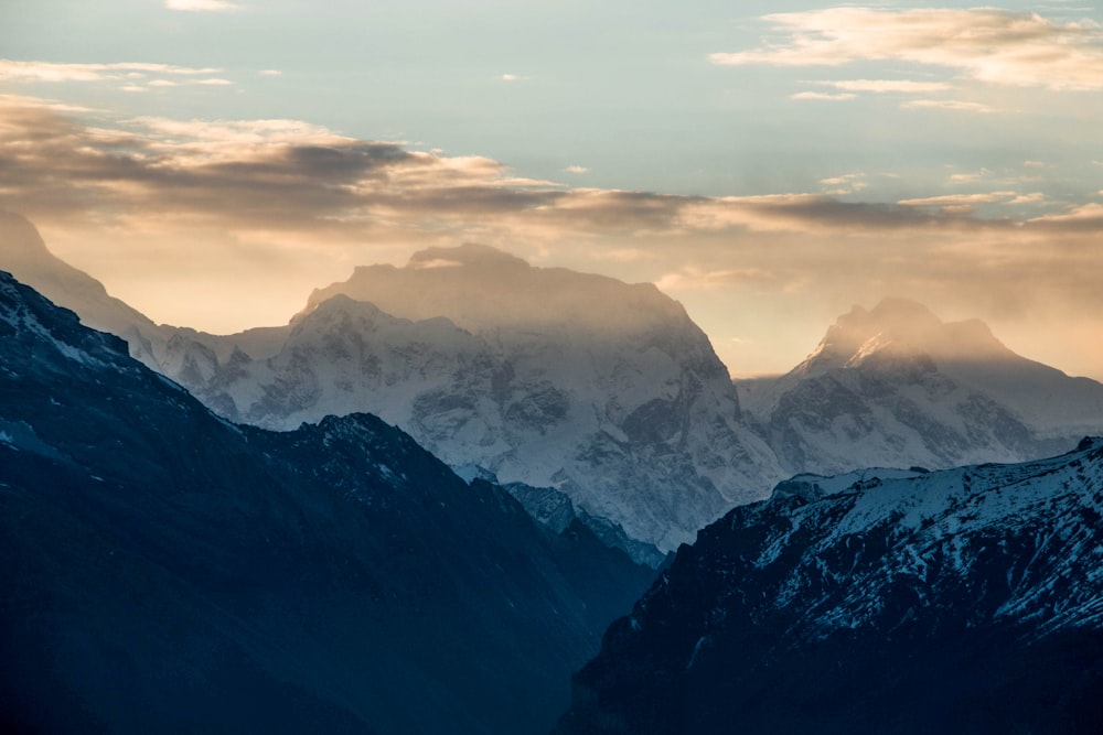 a view of the mountains and clouds