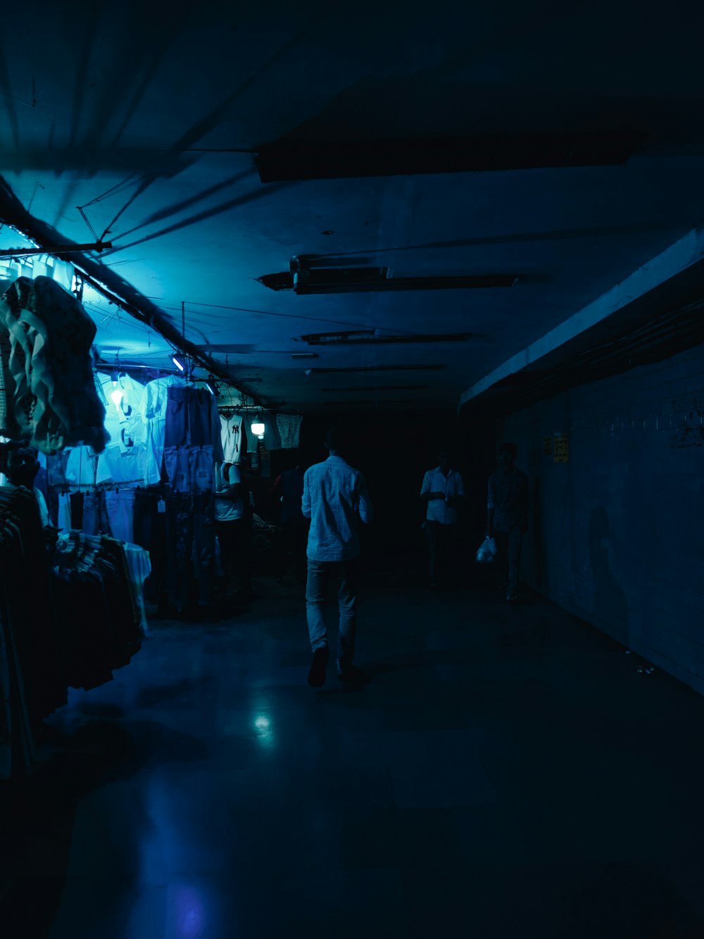 a person walking down a dark street