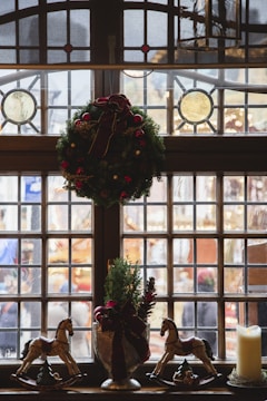 A beautifully decorated window with festive watercolor art.