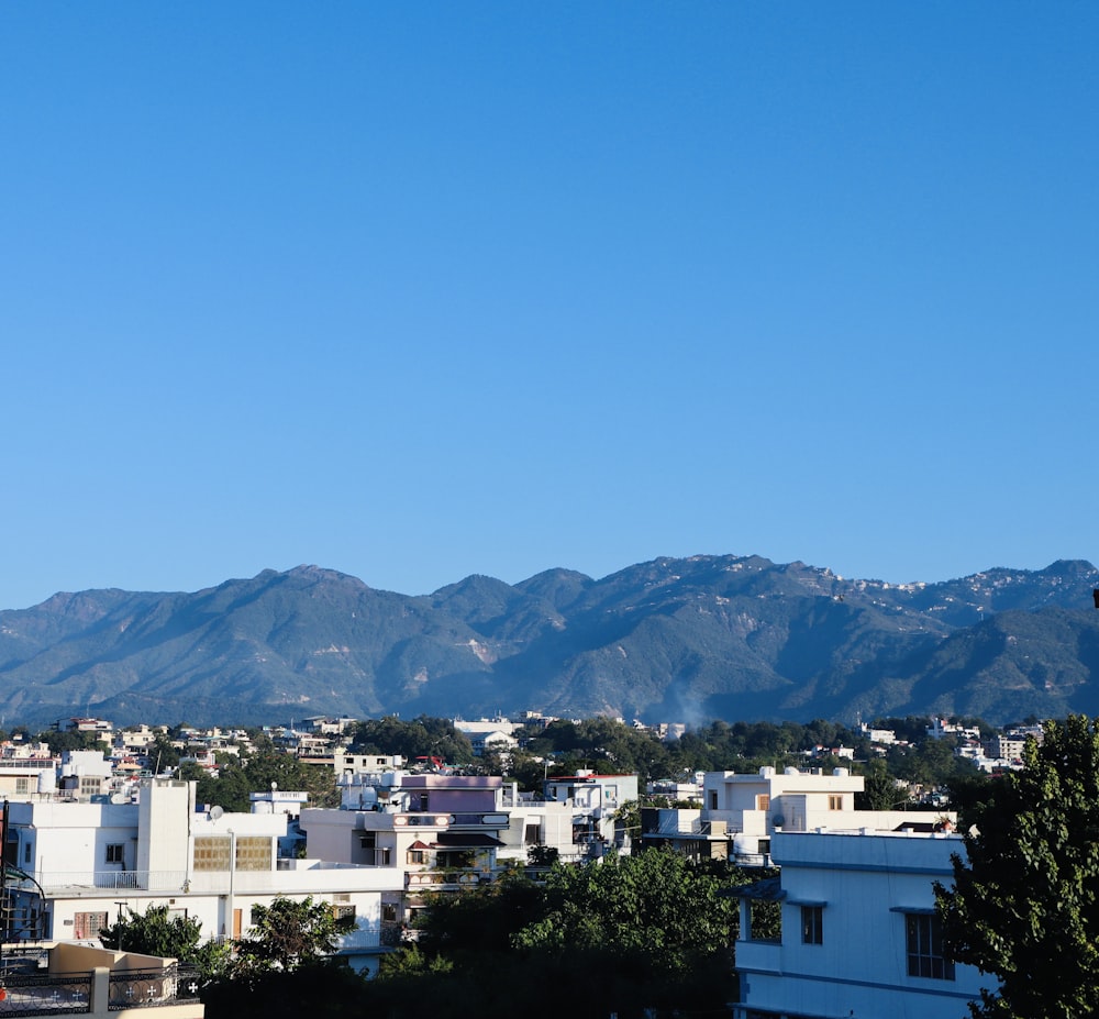 a city with a mountain in the background