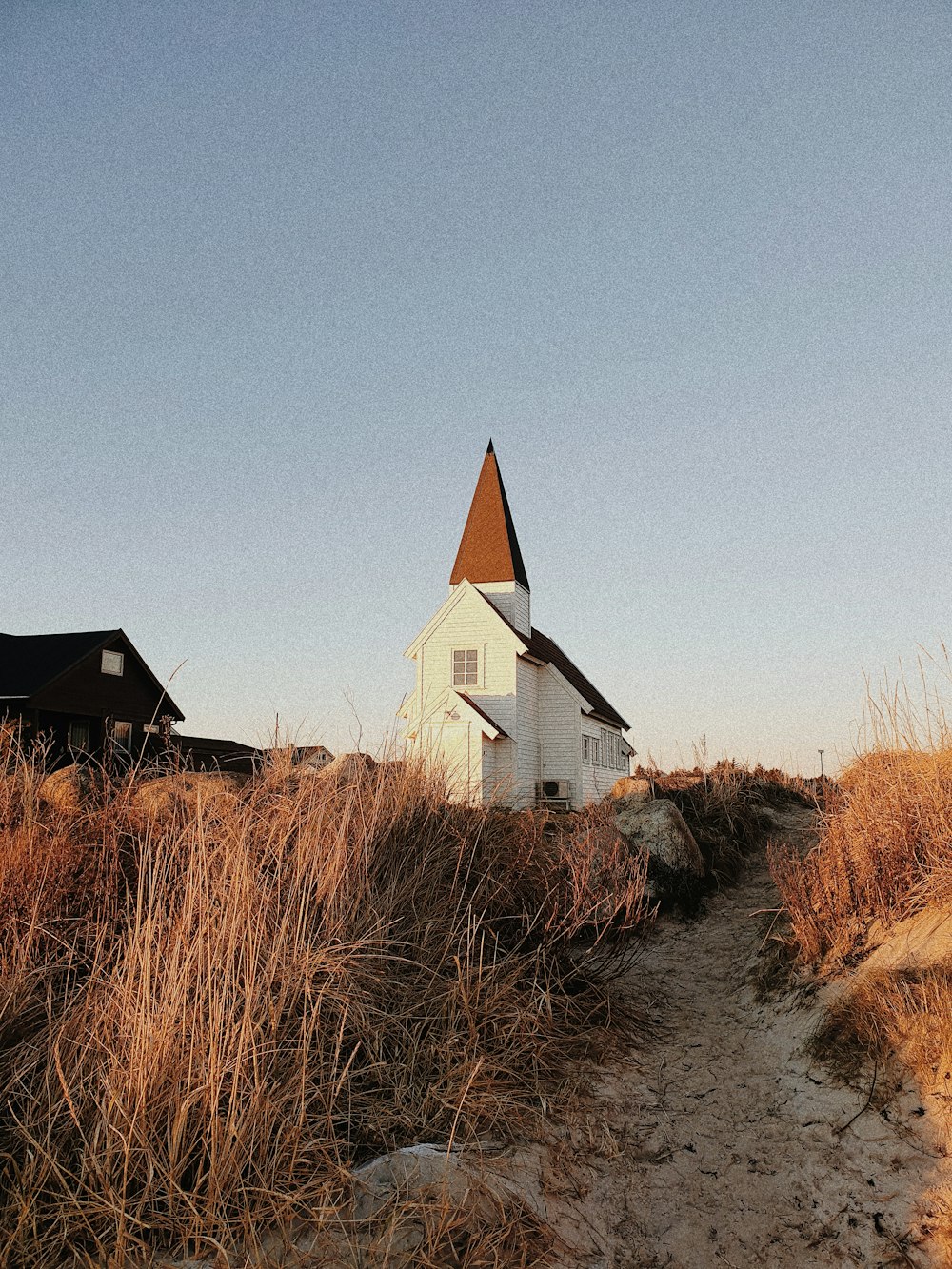 a white house with a steeple