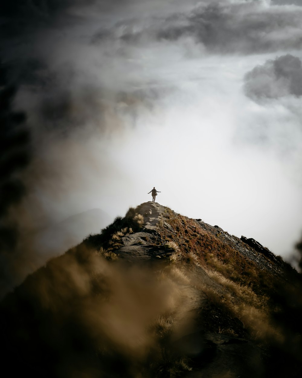 a person standing on a mountain