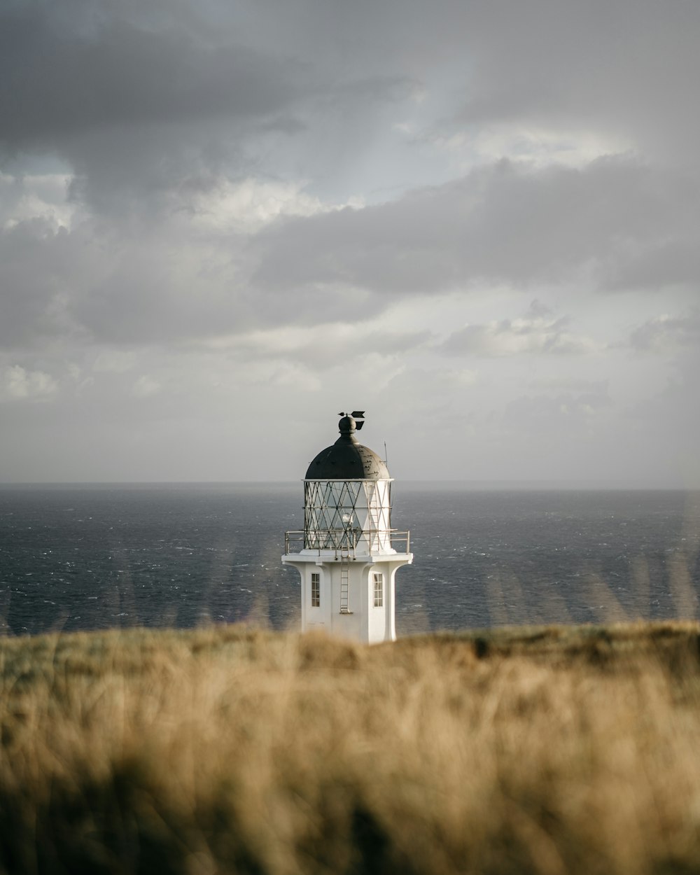 a lighthouse on a hill