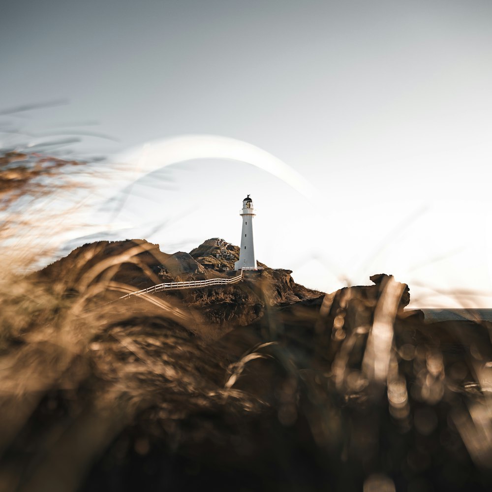 a lighthouse on a rocky cliff