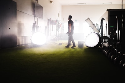 An athlete and influencer collaborating on content creation in a bright studio.