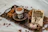 Close-up of a delicate Turkish coffee set on a wooden tray with soft natural light highlighting its elegant design.
