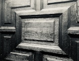 Close-up of a beautifully finished wooden door with a glossy surface.