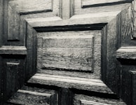 A close-up of detailed woodwork on a door.