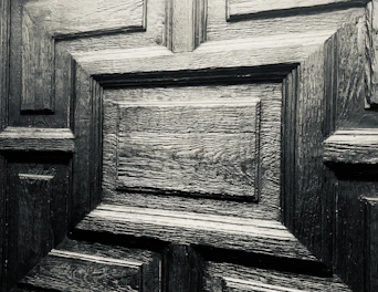 Close-up of Garofoli door textures showing wood grain and glass inserts