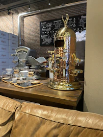 Stylized dashboard displaying coffee market trends and analytics in gold and bronze tones.